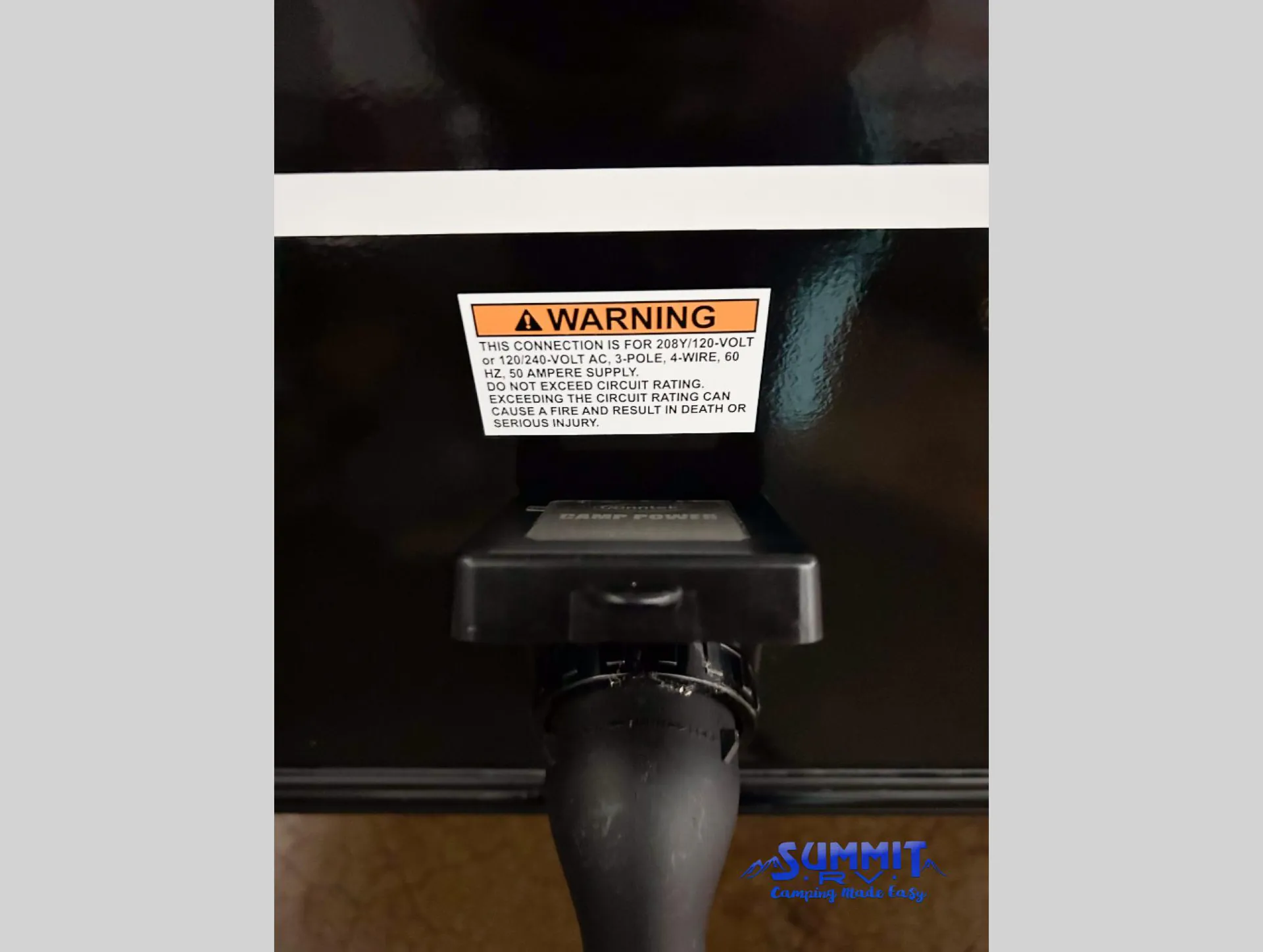 2027 Grand Design Reflection 362TBS — Exterior-mounted electrical connection and warning label are visible on the RV body