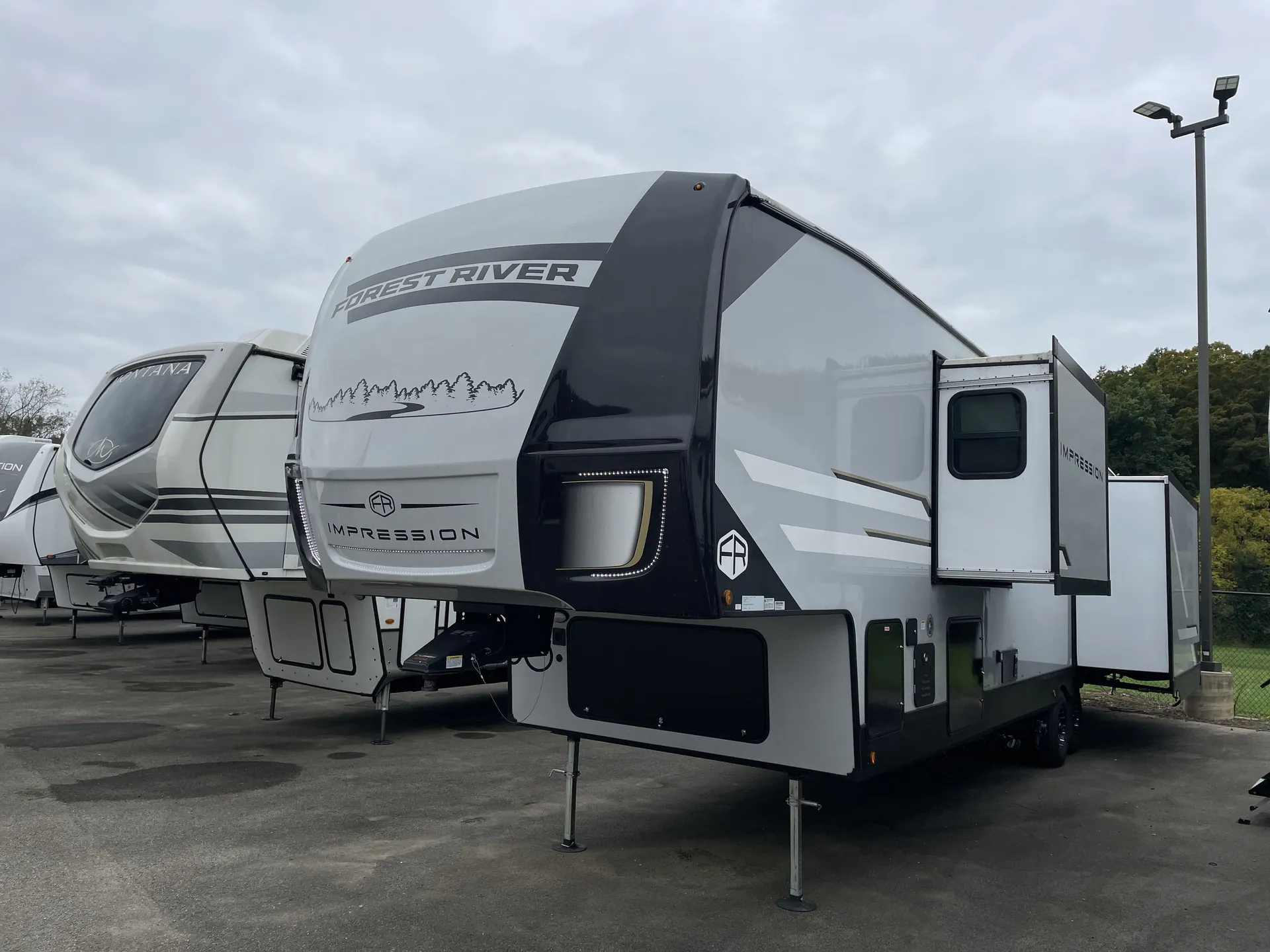 2025 Forest River Impression 360MYR — off campside