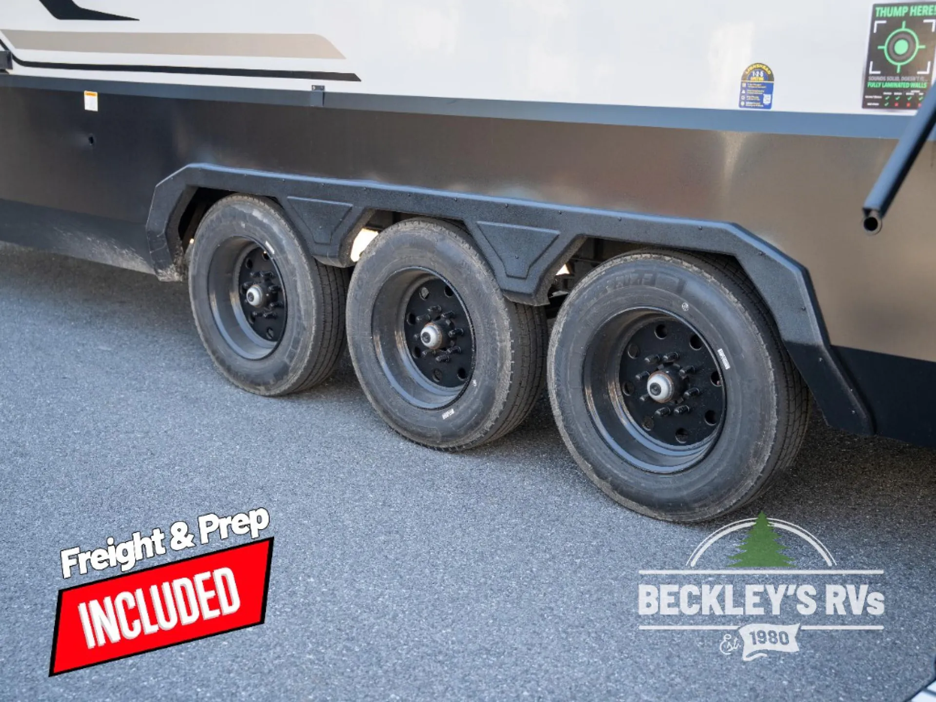 2026 Grand Design Foundation 42GD — Visible exterior underbody area with three RV wheels and wheel arches