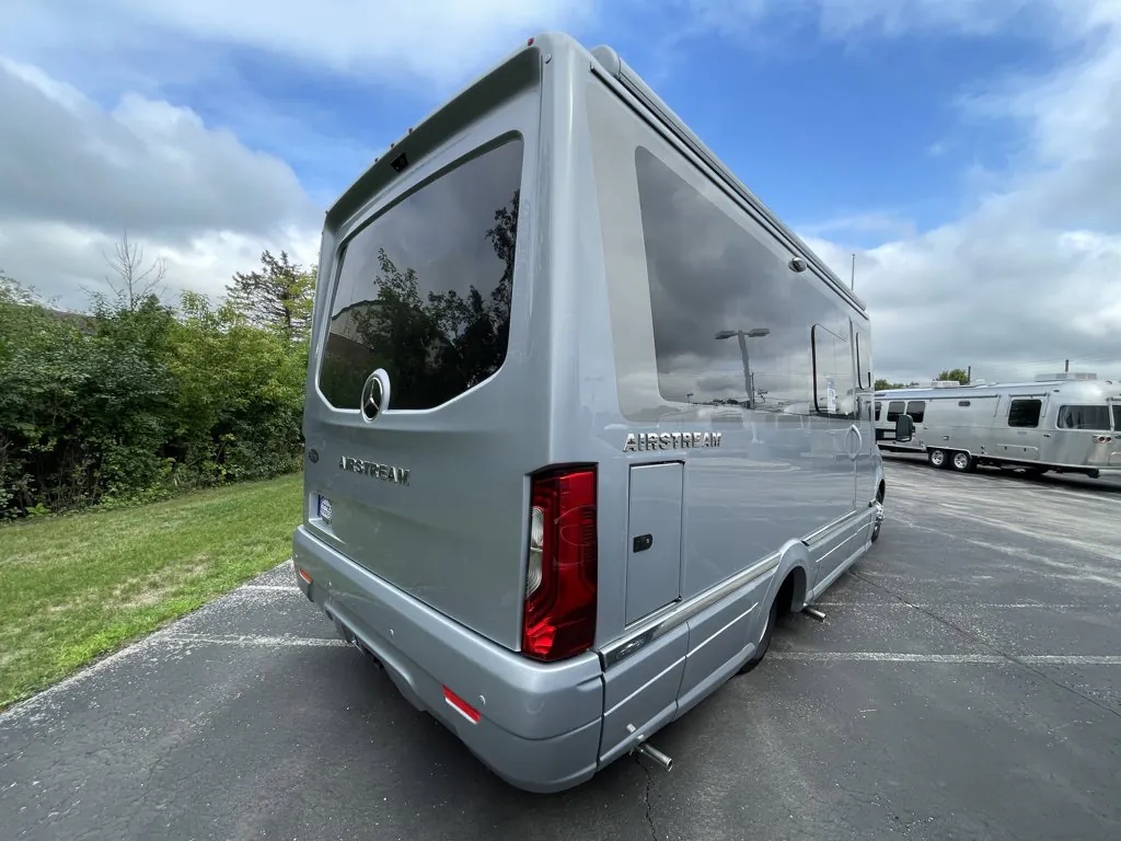 2026 Airstream Atlas Murphy Suite — The rear-left exterior of the motorhome, including rear window, taillight, body, and side