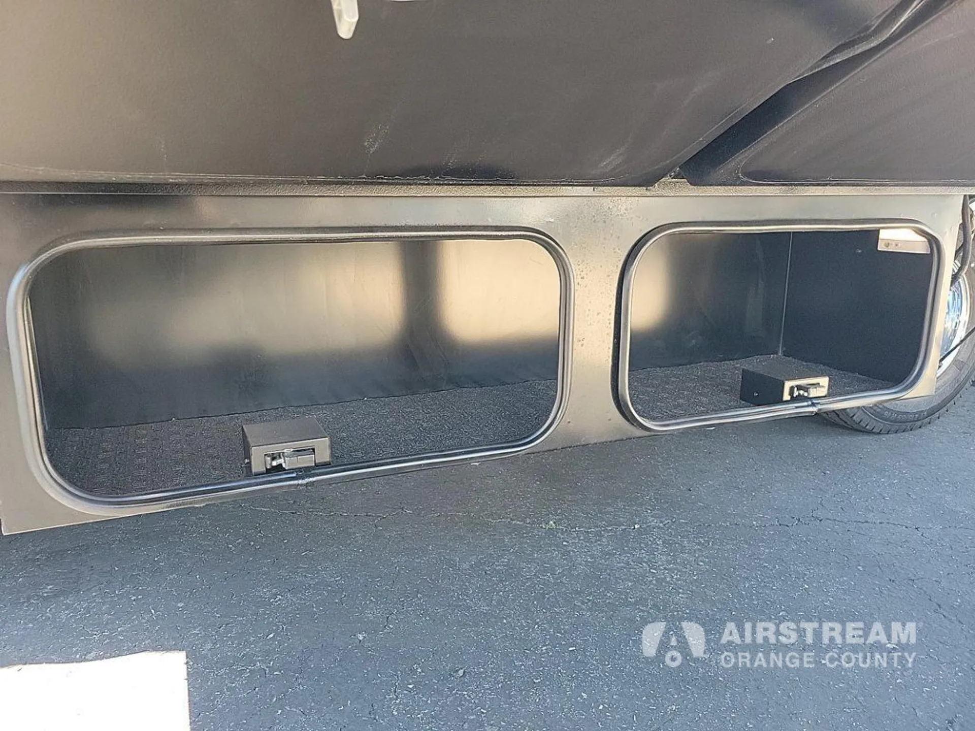 2026 Airstream Atlas Murphy Suite — Open exterior cargo/storage compartments are the primary visible subject