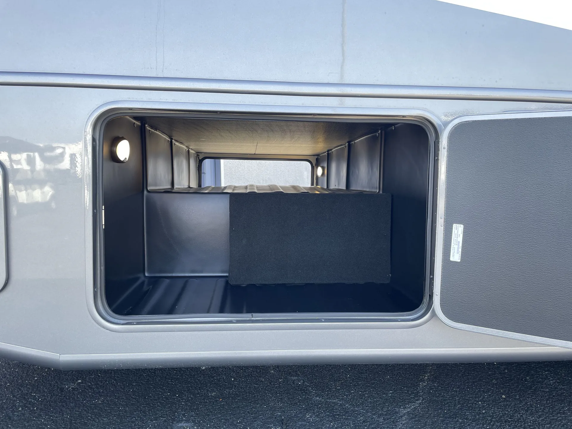 2027 Jayco Alante 29F — An open exterior cargo/pass-through storage compartment