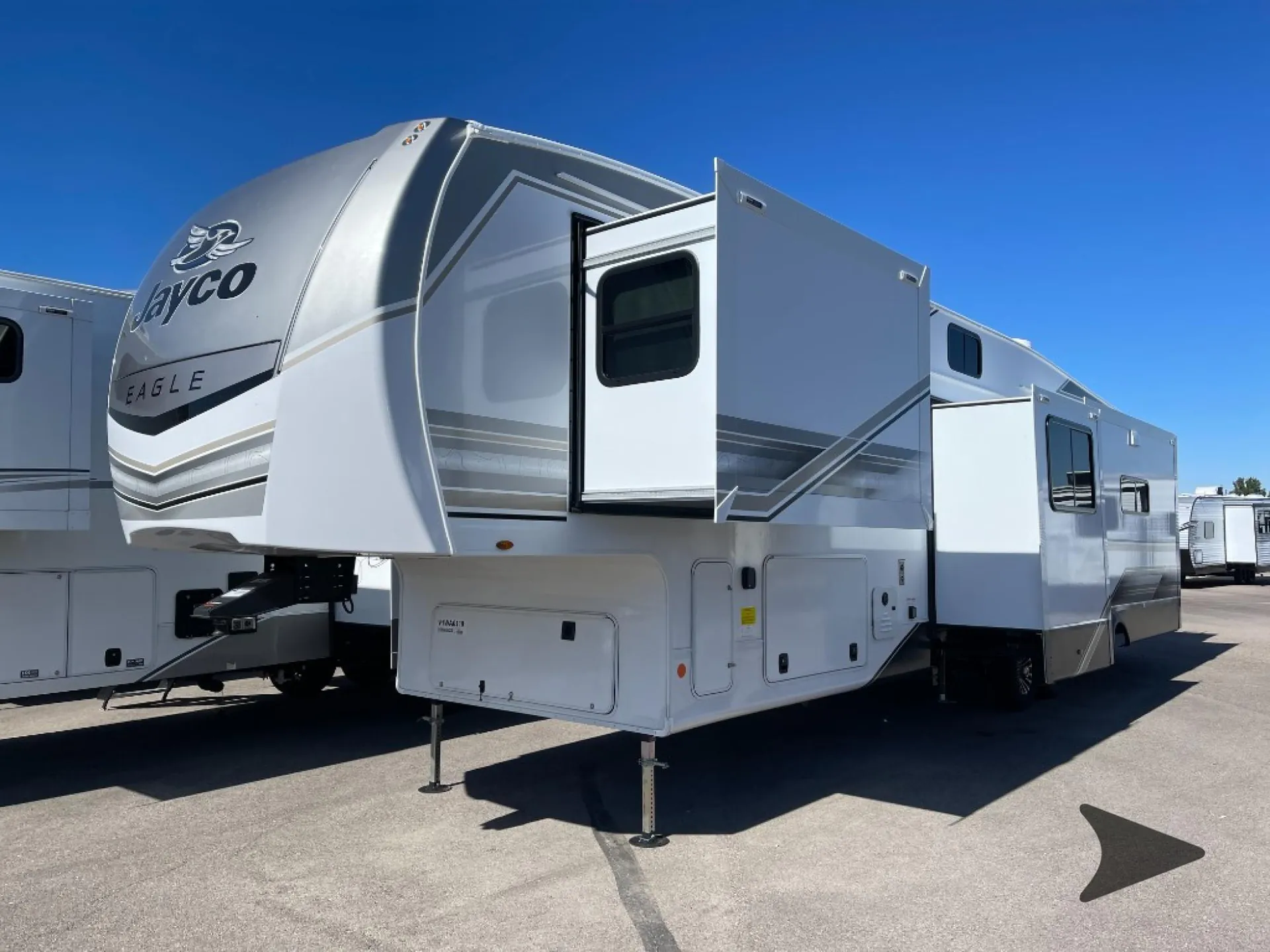 2027 Jayco Eagle 355MBQS — Visible exterior front and side of the Jayco Eagle fifth-wheel RV, including hitch, body, and slide-outs