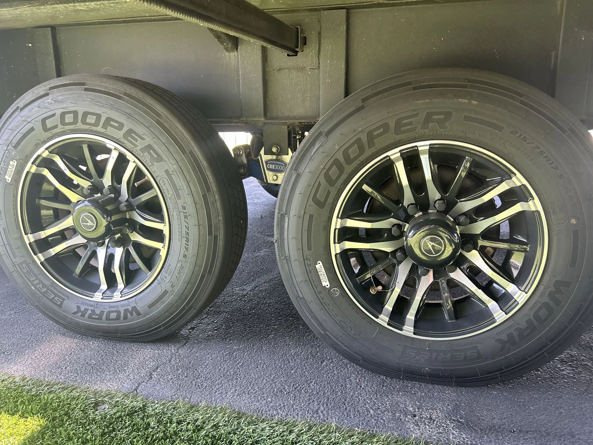 2026 Grand Design Solitude 391DL — Photograph clearly shows the RV's exterior wheels and tires beneath the unit