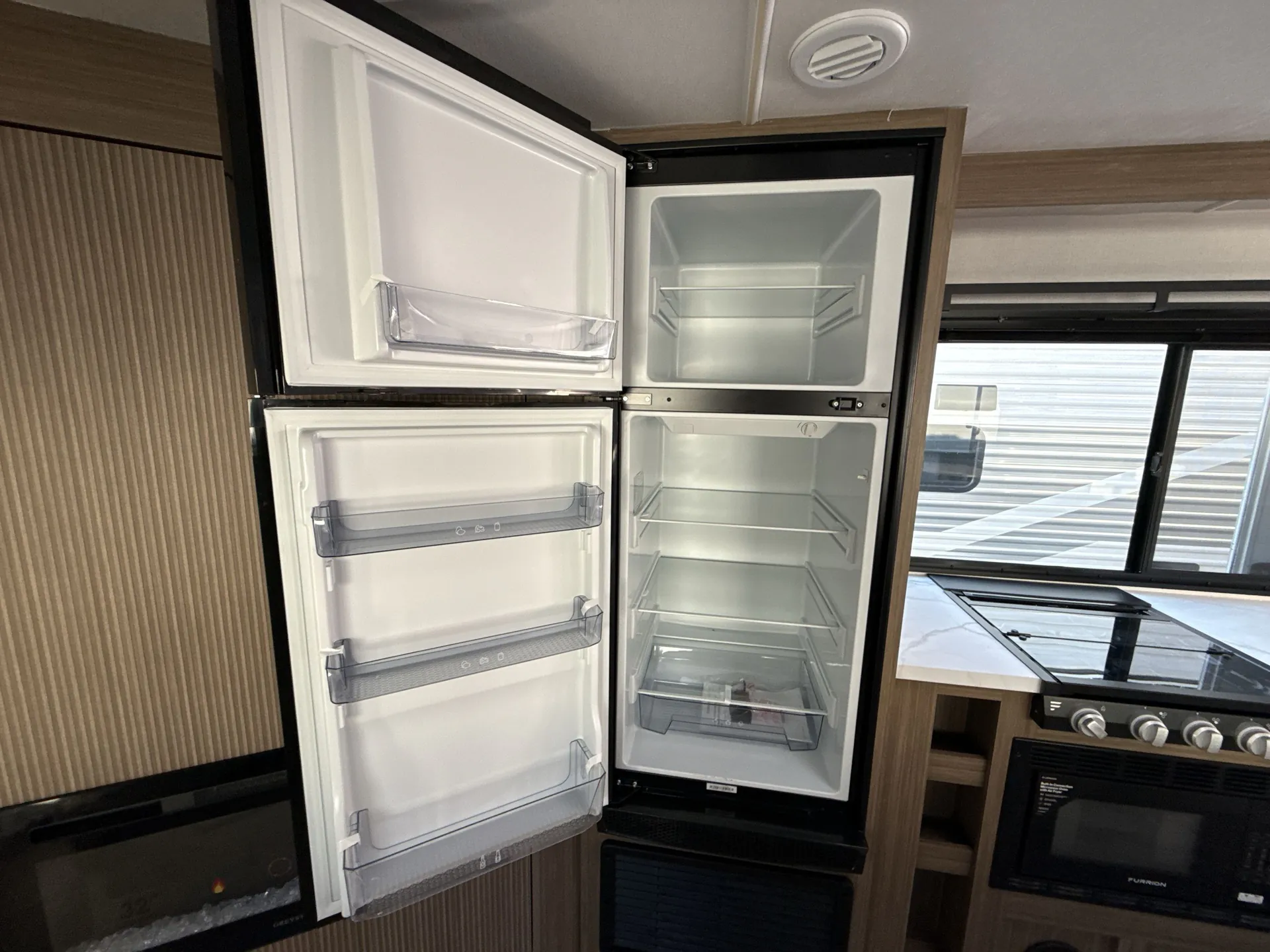 2026 Forest River Wildwood X-Lite 26ICE — fridge open