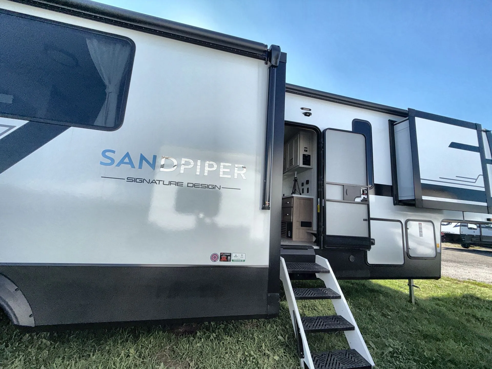 2027 Forest River Sandpiper 3710HBFB — off campside